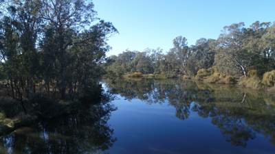 Photograph of the blue sky reflecting off the surface of the Goulburn River on a sunny day