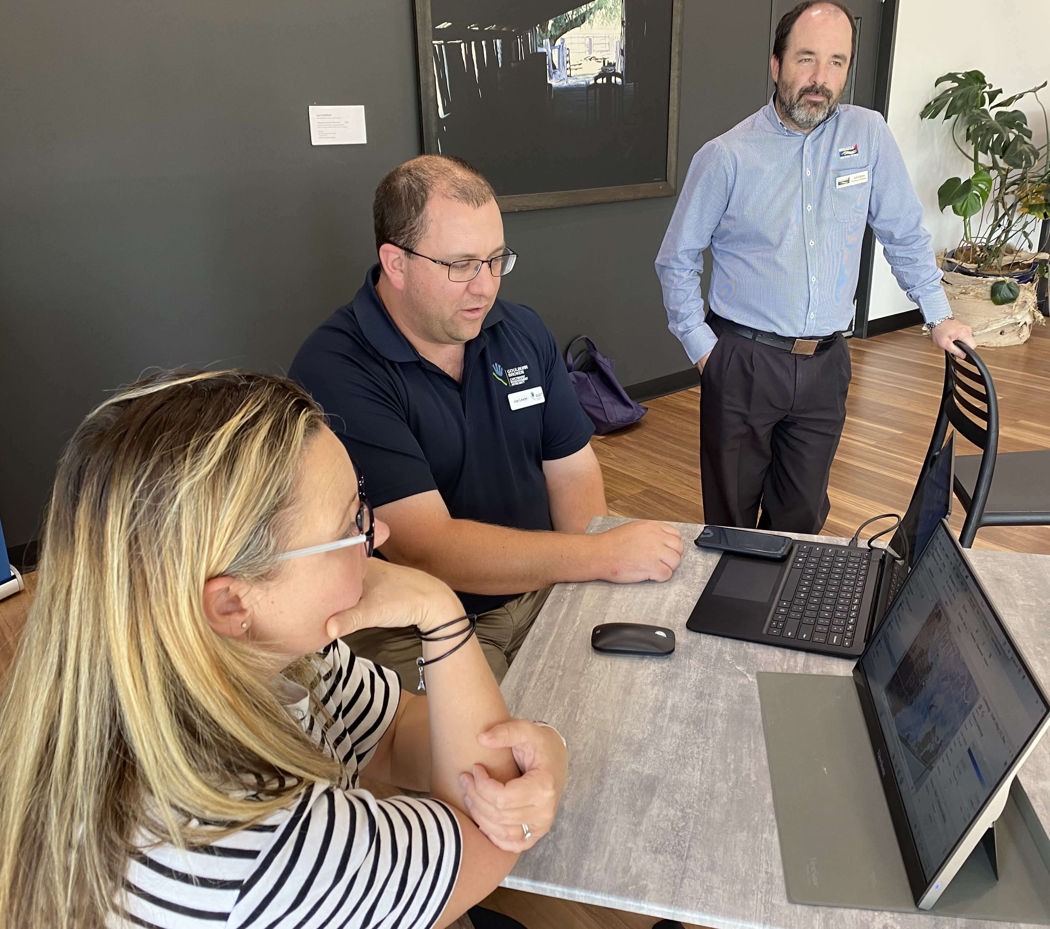 Individuals reviewing the flood study