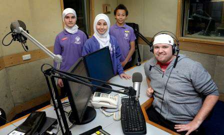 Wilmot Road Primary School students (from left) Rusil Alghazaly, Heba Altimimi and Levi Williams with Start FM's Christopher Marienfield.